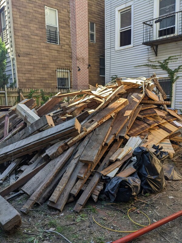 Pile of wood and lumber debris before hauling